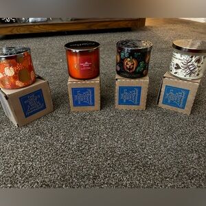 4 3 wick candles from Bath and Body Works.